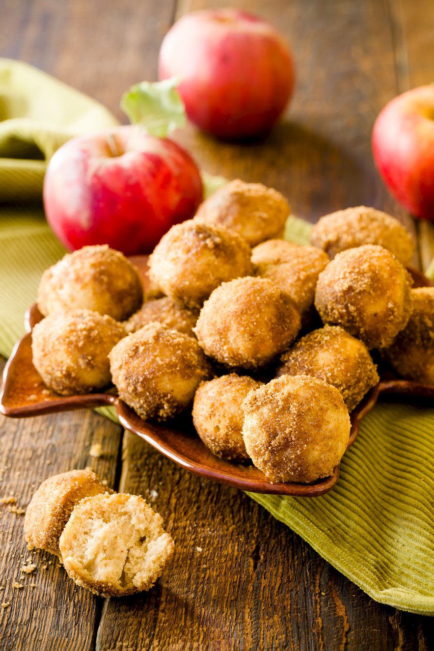 Apple Cider Donuts with apples in the background