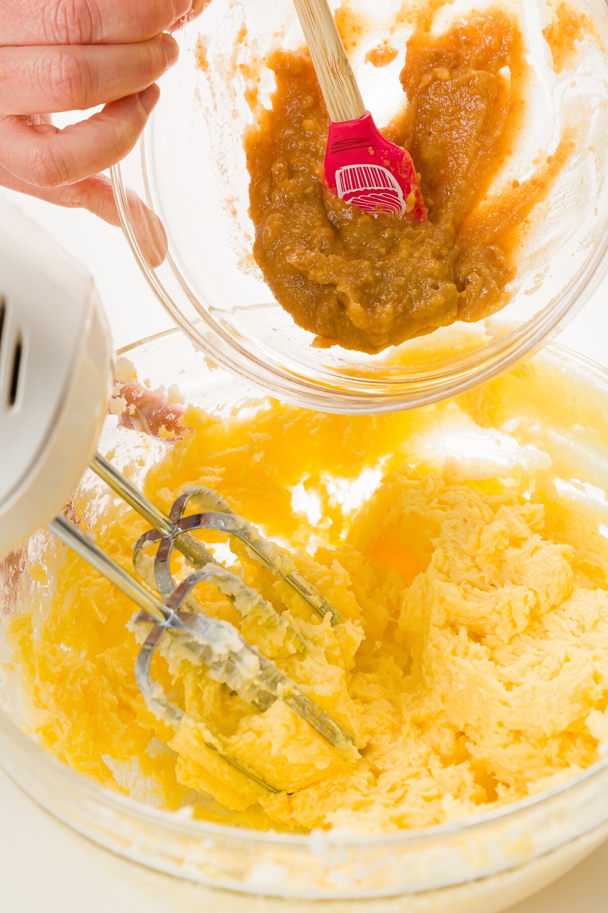 Adding melted marzipan to the batter
