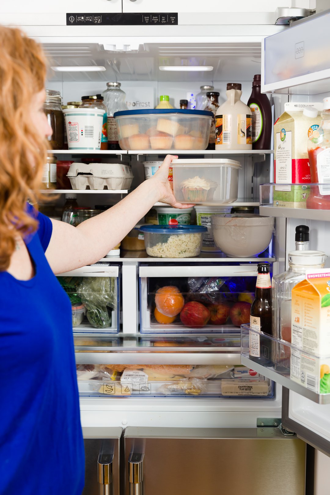 Pulling cupcakes from Beko Refrigerator