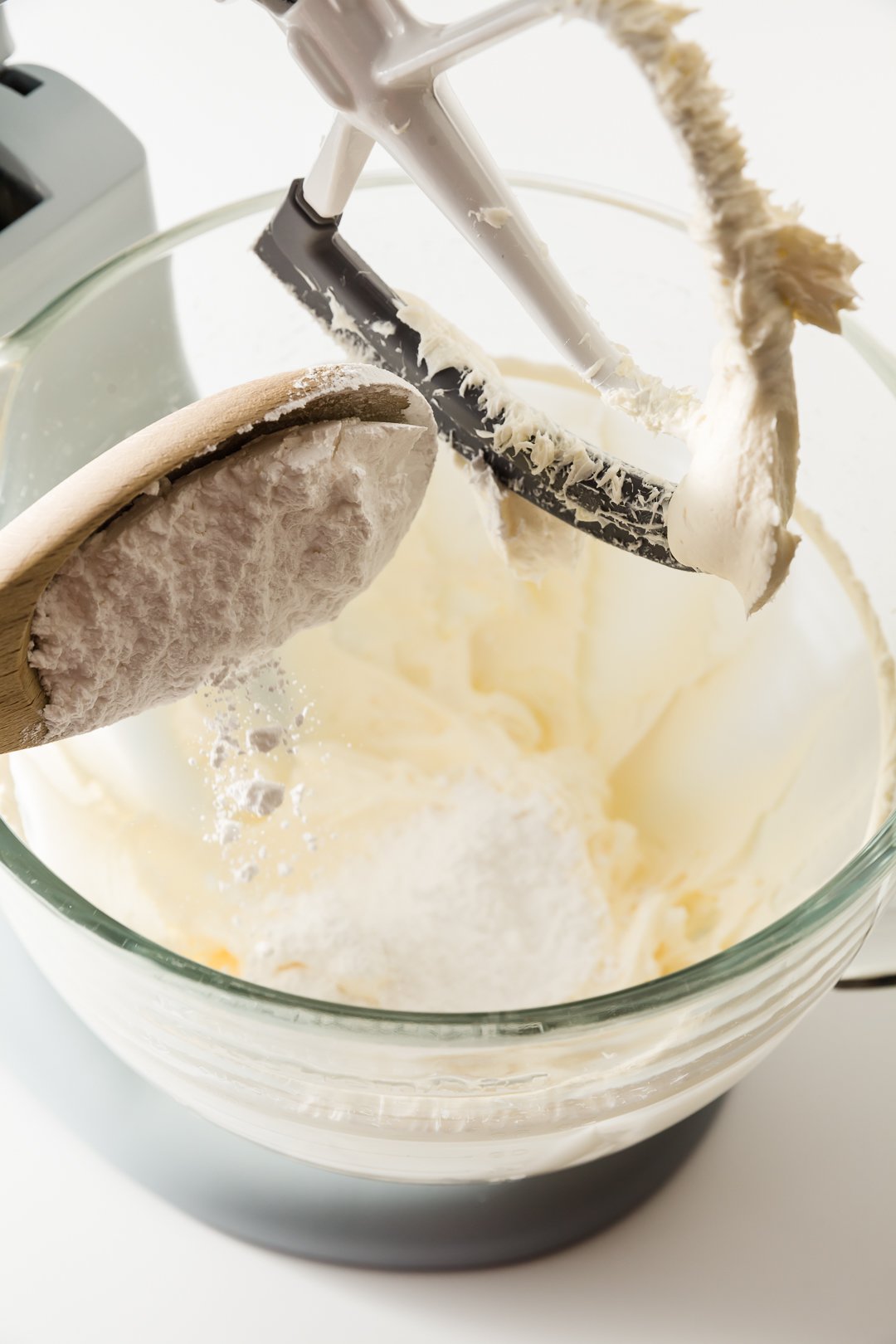 Adding powdered sugar to cream cheese frosting