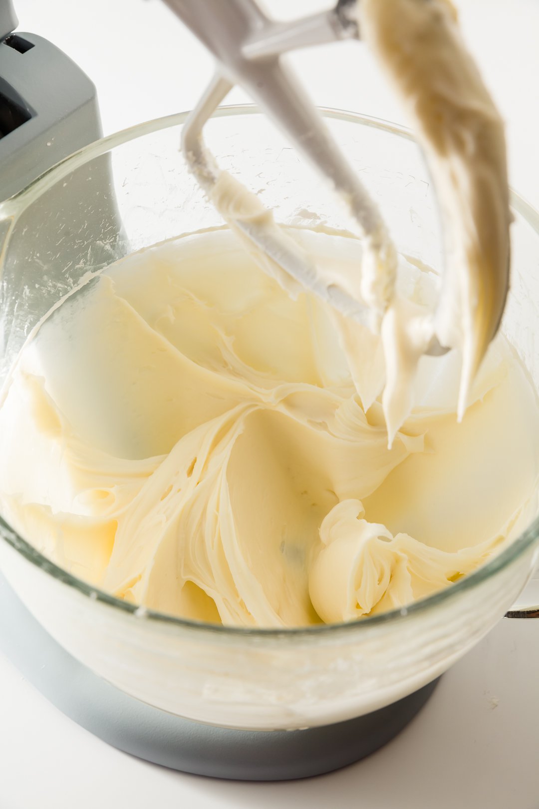 Mixing butter and cream cheese in a stand mixer