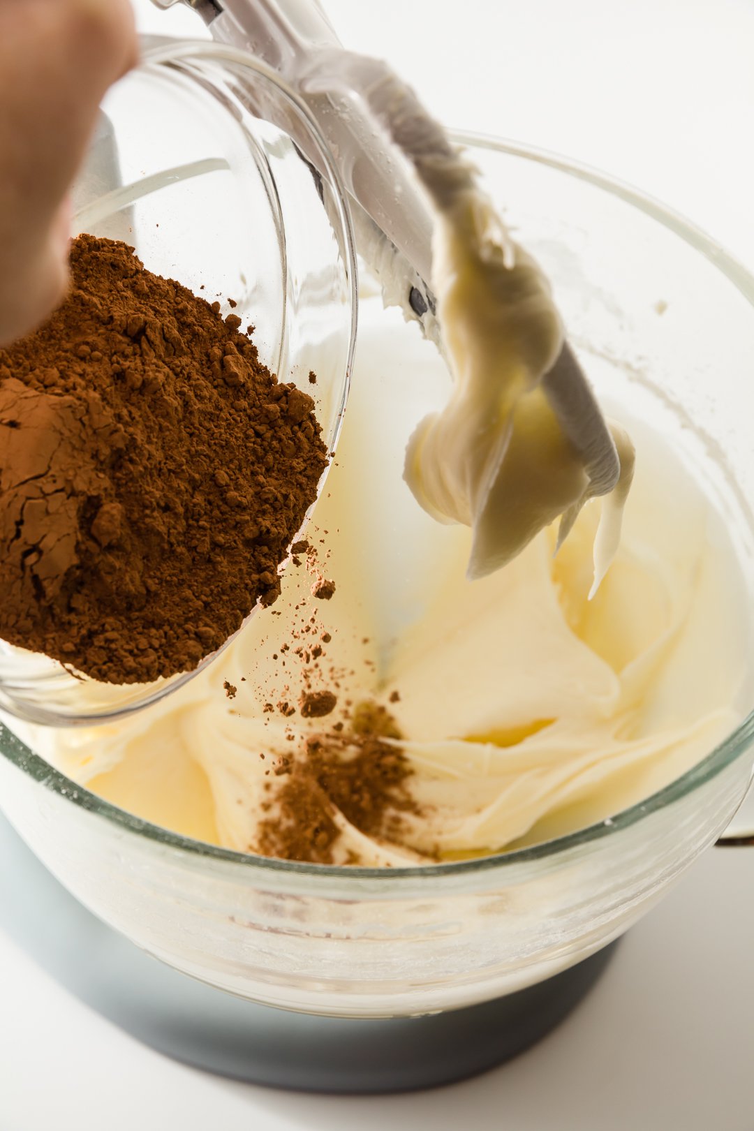 Adding cocoa powder to chocolate cream cheese frosting
