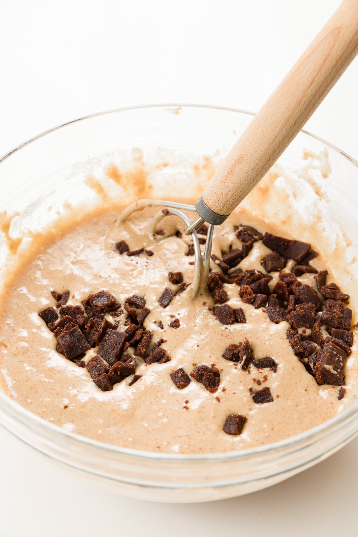 stirring cinnamon chips into batter