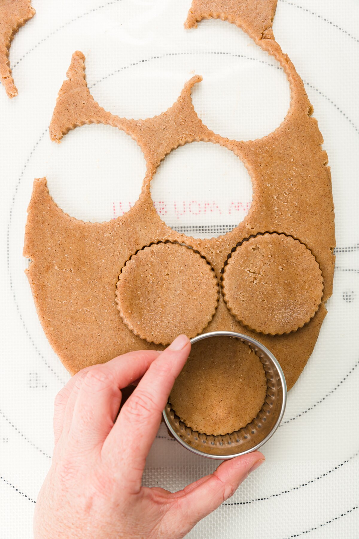 Overhead shot of cutting out circles of cookie dough 