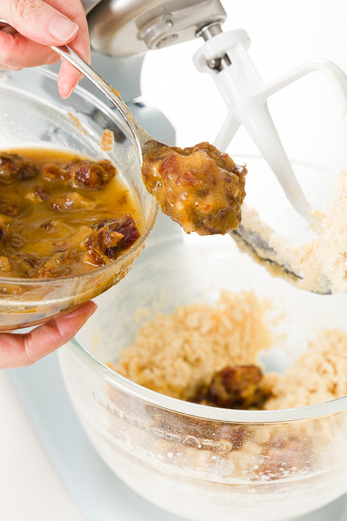 Adding dates to a bowl of batter