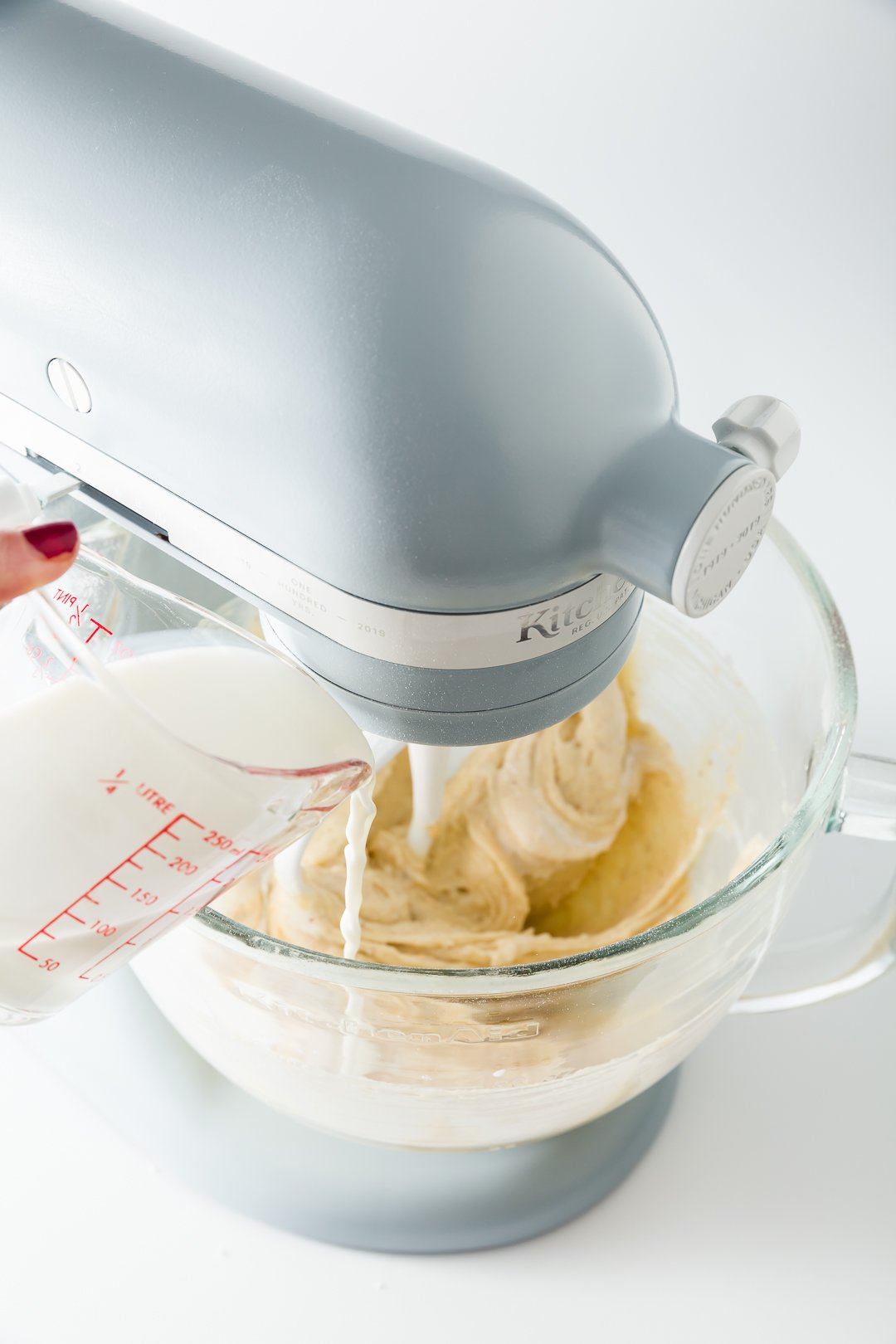 Adding milk to dulce de leche cake batter