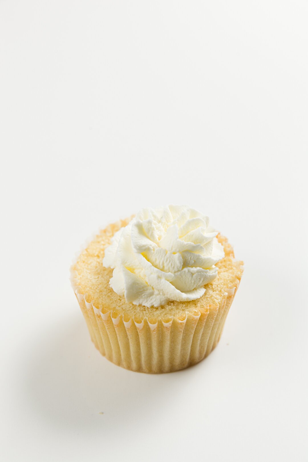 Whipped cream on a butterfly cake