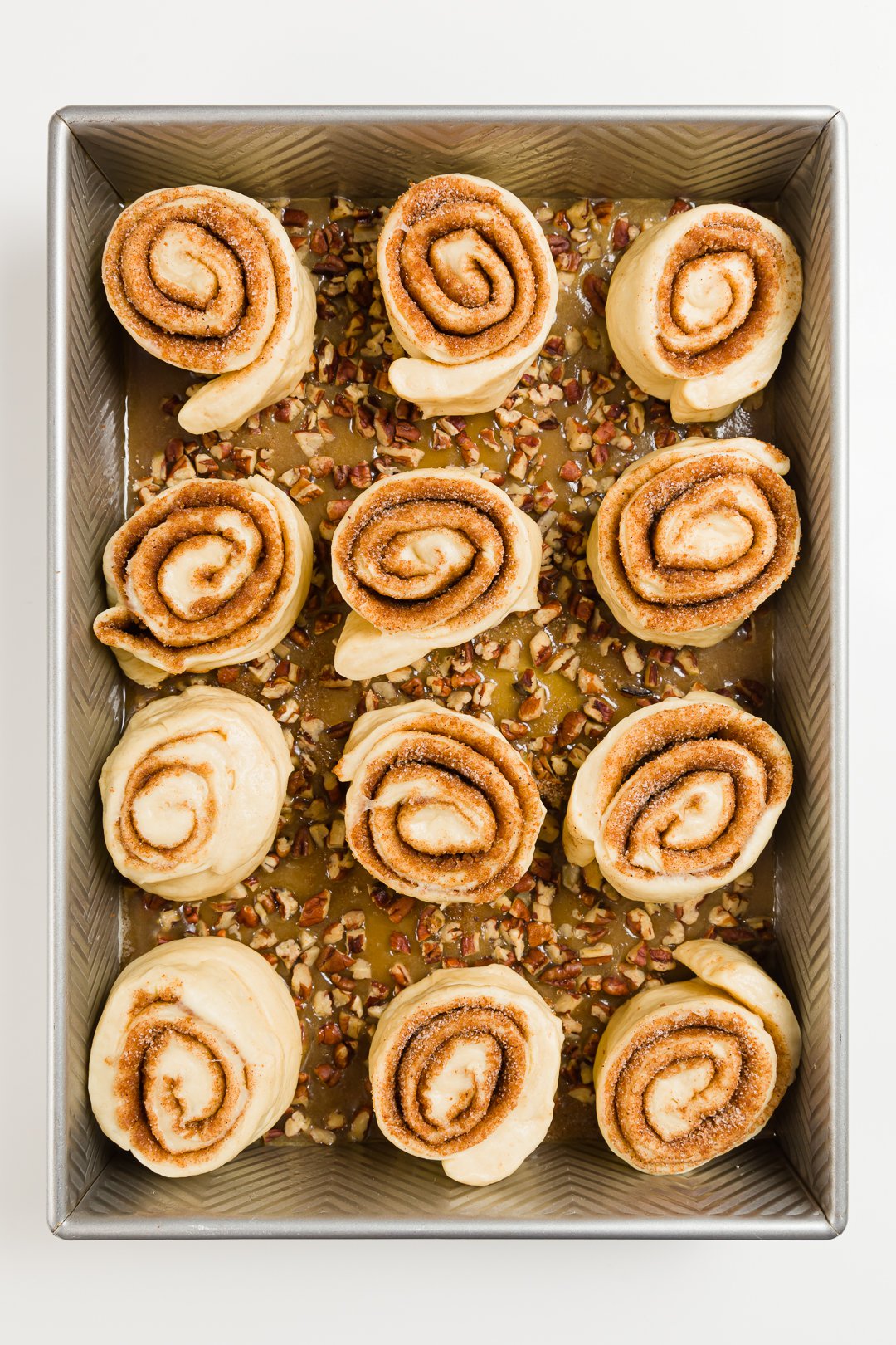 Honey buns sitting on top of topping