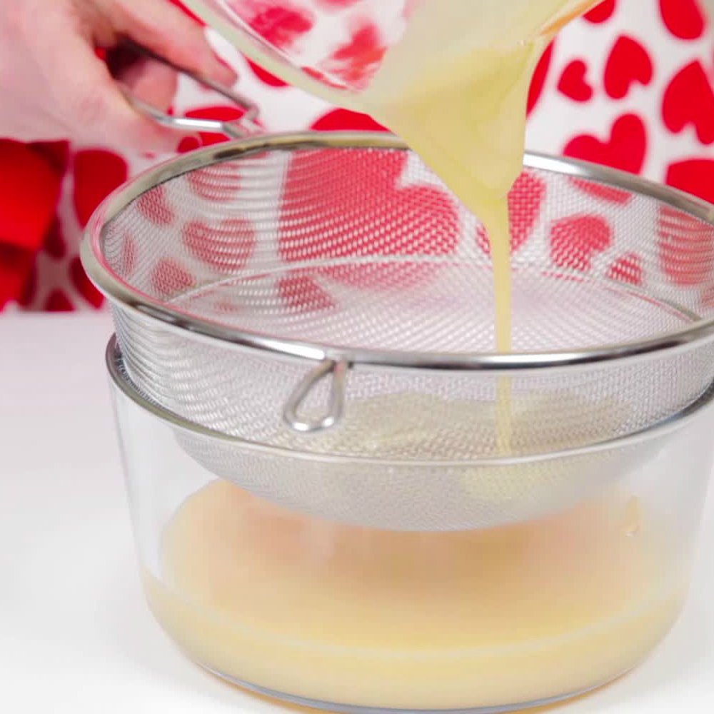 pouring glaze through a sieve