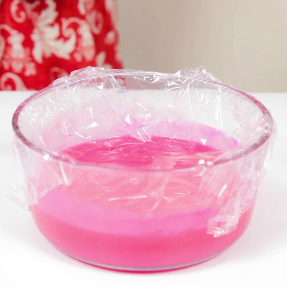 glaze with food coloring covered in plastic wrap