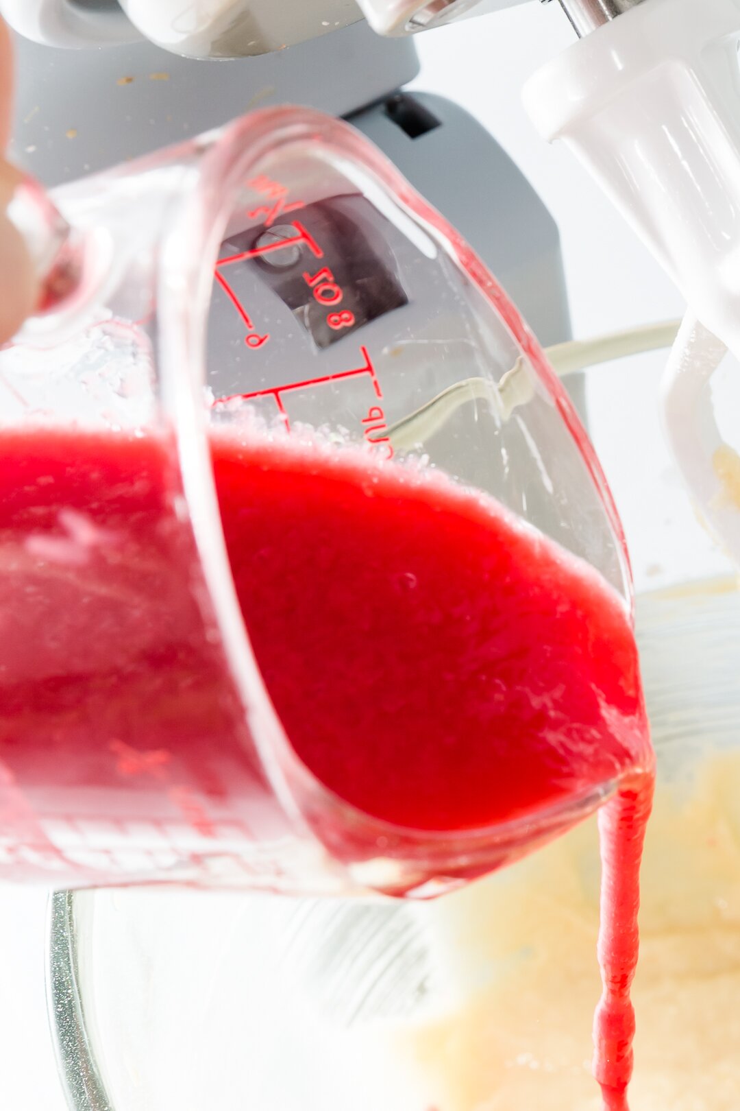 Pouring pureed raspberries