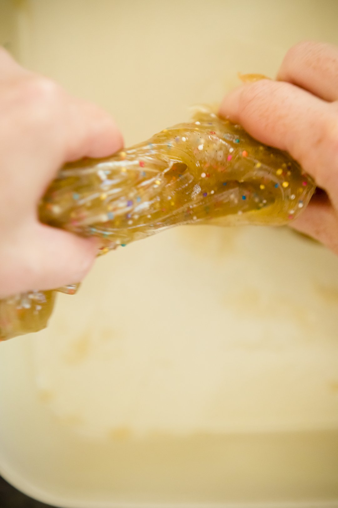 Pulling a thick brown piece of salt water taffy