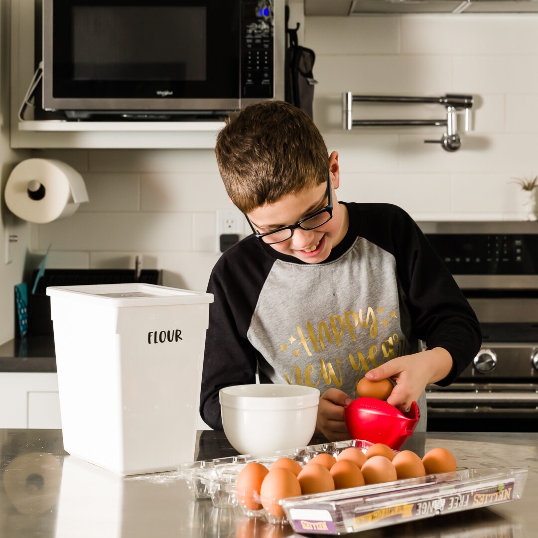 Cracking eggs to add to batter