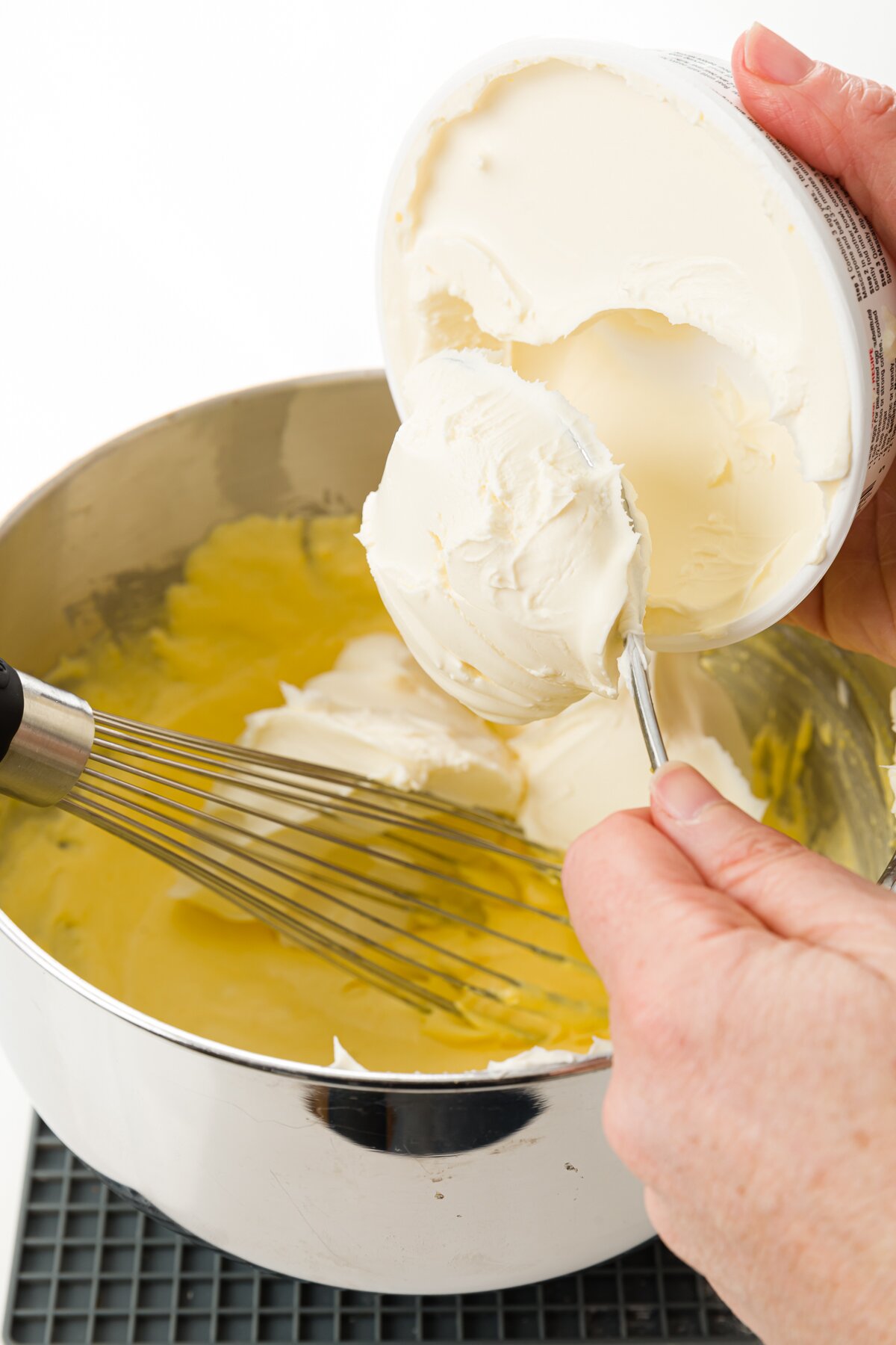 Stef adding mascarpone to the mixture of sugar and egg whites