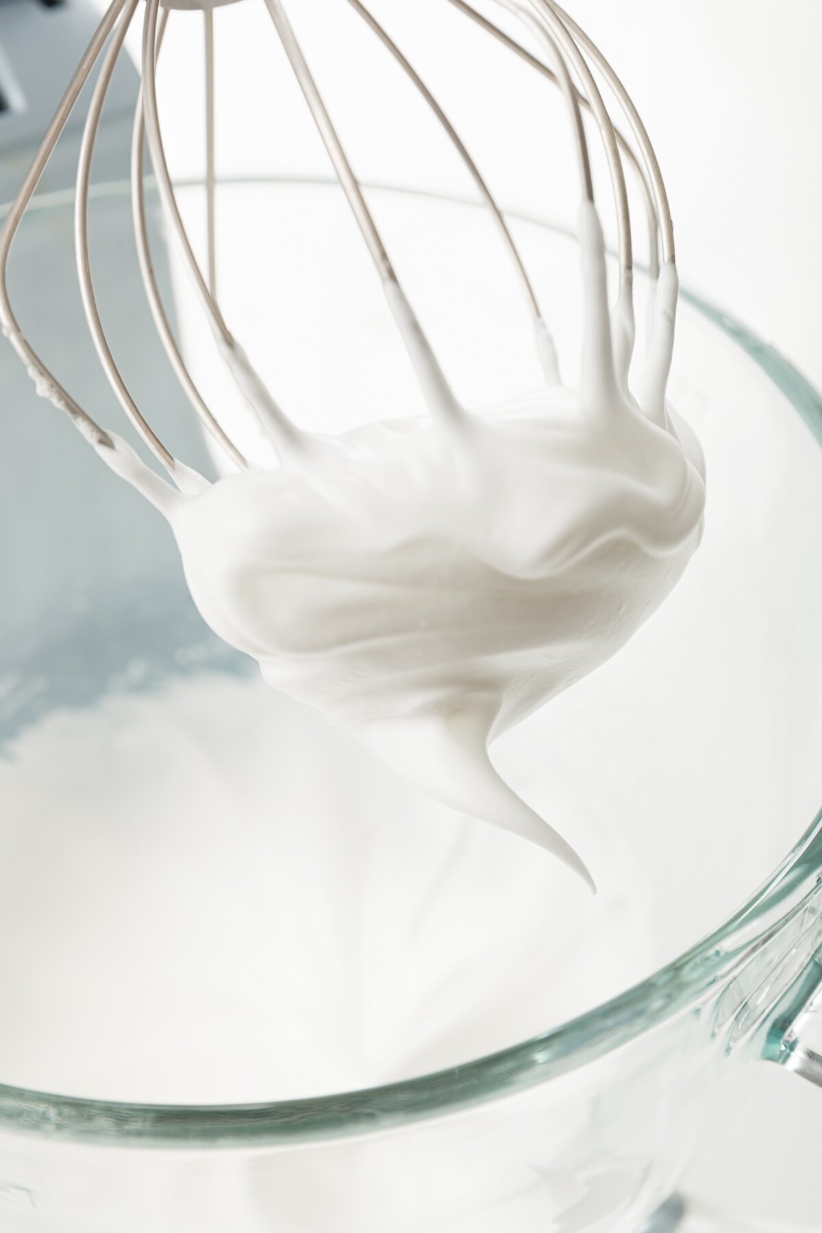 tight shot of egg whites whipped until stiff peaks formed
