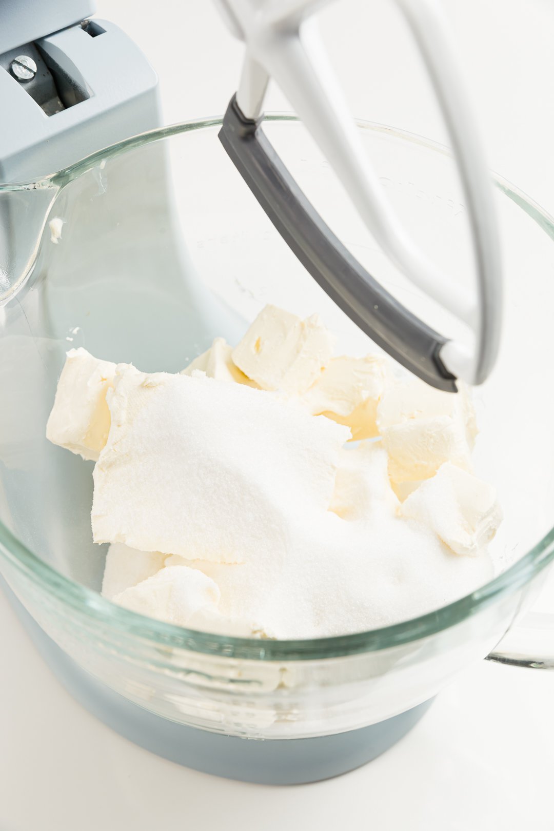 looking down at butter and sugar in the bowl of a stand mixer