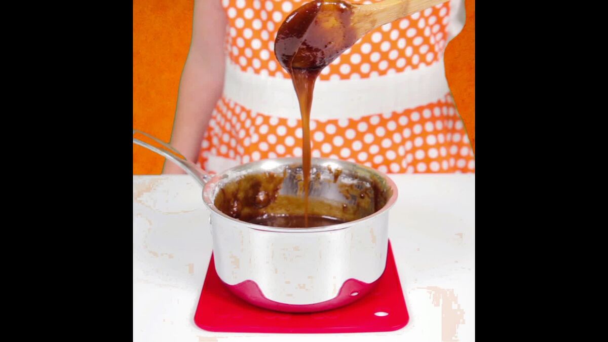 Apple butter icing dripping from pot