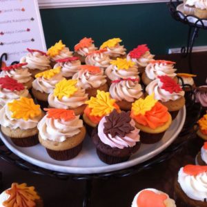 Display of fall decorated wedding cupcakes